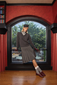 NUE NOCTURNE SHORT PLEATED BUCKLE SKIRT